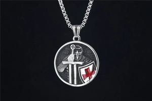 Detailed relief of a crusader knight on a round pendant with red enamel cross accents