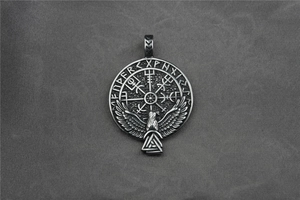 Detail of Viking Vegvisir compass and eagle pendant with Elder Futhark rune engravings