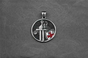 Detailed relief of medieval knight helmet and red cross shield on steel pendant