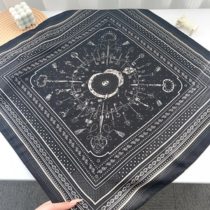 Detail of vintage navy silk scarf with elegant key and paisley pattern prints