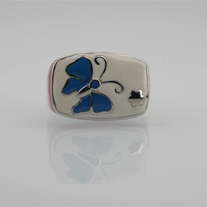 Perle papillon vintage en acier titane avec motif bleu et petit détail d'étoile argentée