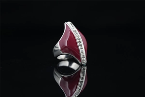 Macro view of vintage style steel ring with red enamel and pavé rhinestones
