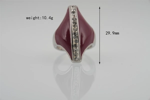 Detail view of irregular titanium steel ring with red enamel and vertical inlaid crystals