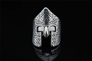 Close-up of vintage silver Spartan helmet ring with detailed metal textures and engravings