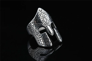 Macro detail of Spartan helmet ring with vintage finish and intricate mesh texture