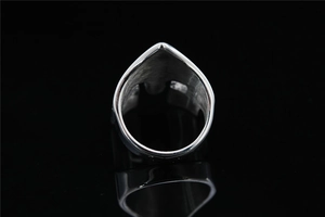 Macro view of Viking Spartan mask ring showing brushed metal texture and ring thickness