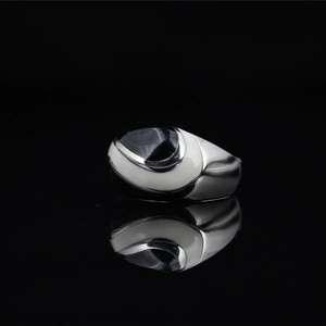 Ethnic style chunky titanium steel ring with black oval stone and white enamel accents