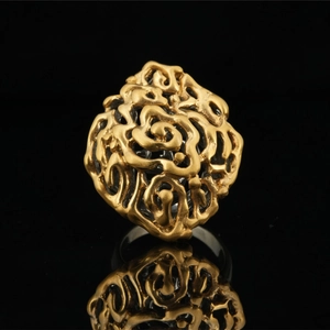 Retro hollow floral pattern ring in gold-toned titanium steel with a 3D relief texture