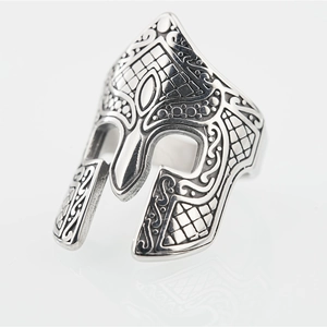 Vintage silver Spartan helmet ring for men with detailed engraving on white background