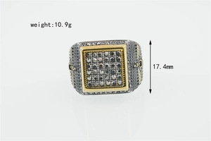 Detail view of square titanium steel eagle ring with grey rhinestones and gold edges
