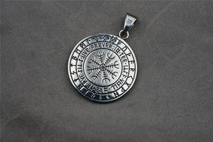 Macro shot of silver Viking Vegvisir compass pendant with detailed Nordic rune engravings