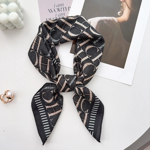 Fashionable black scarf with artistic letter print and elegant golden pearl ring accessory