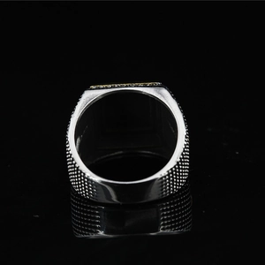 Men's eagle square signet ring with golden accents and textured steel finish