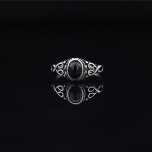 Vintage gothic style titanium steel ring with black oval stone and intricate scrollwork