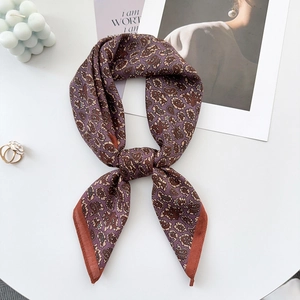 Elegant purple paisley silk scarf with retro floral pattern on a minimalist background
