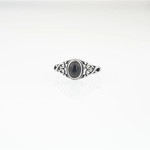 Vintage oxidized silver ring with oval black gemstone and hollow floral engraving