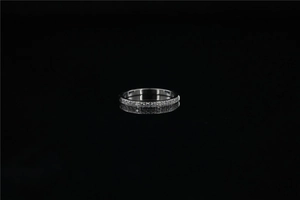 Detail of silver eternity ring featuring micropavé set round cubic zirconia stones