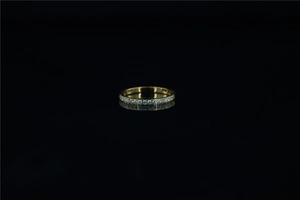 Detailed view of elegant gold-plated ring featuring shimmering round-cut cubic zirconia