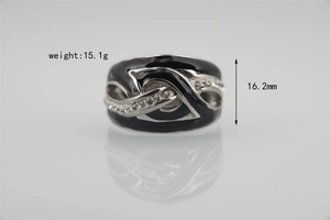 Detail view of black enamel ring with silver lines, clear crystals and 16.2mm height