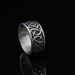 Vintage silver Viking ring for men with Celtic knot geometric patterns on black background
