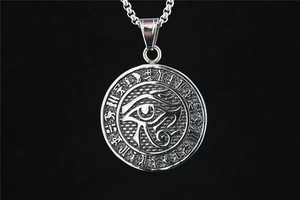 Close-up of Horus eye titanium steel pendant with ancient Egyptian hieroglyph symbols