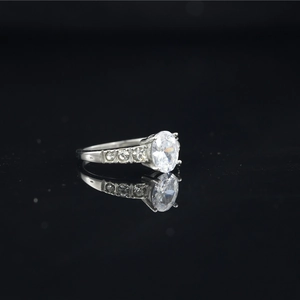 Classic oval cut moissanite engagement ring in silver finish with side stone accents