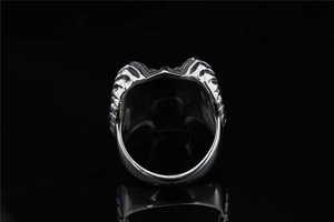 Macro view of vintage punk skull ring with detailed 3D relief on wide titanium steel band