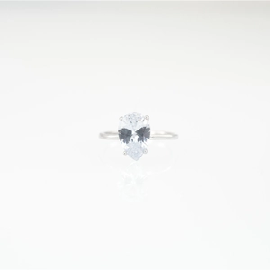 Minimalist silver titanium steel ring featuring a pear-cut teardrop cubic zirconia stone