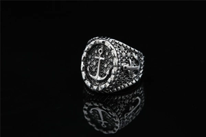 Macro shot of vintage steel anchor ring with nautical cable textures and honeycomb details