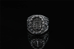 Detailed macro view of retro stainless steel anchor ring with oxidized industrial texture