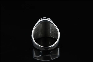 Macro shot of polished silver steel inner band with brushed texture and engraved edge