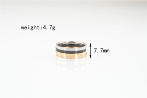Detail view of 4-piece titanium steel ring set showing 7.7mm width and 4.7g weight