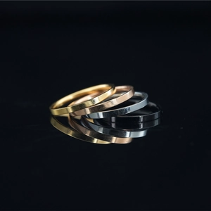 Minimalist four-color titanium steel ring set in gold, rose gold, silver, and black finish