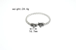 Detail shot of vintage twisted steel tiger head bracelet with 24.4g weight and size labels