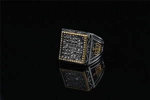 Macro view of vintage stainless steel signet ring with black pavé stones and crown detail