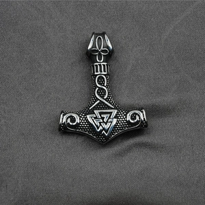 Vintage stainless steel Mjolnir pendant featuring Valknut symbol and Viking engravings