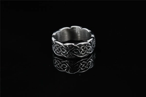 Detail of vintage Celtic knot braided texture on retro silver stainless steel ring