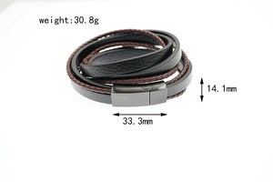 Macro detail of multi-layer braided leather bracelet with gunmetal magnetic clasp