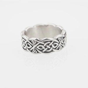 Vintage Viking Celtic knot braided silver ring with reflection on a clean white surface