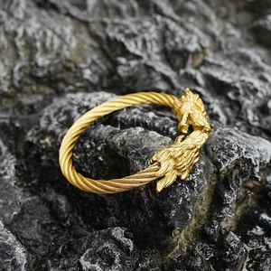 Bracelet jonc ouvert vintage doré avec double tête de dragon et câble en acier torsadé