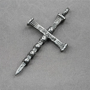 Gothic punk silver cross necklace with skull details and distressed vintage metal finish
