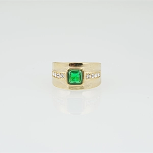 Men's gold titanium ring with green emerald-cut stone and diamond accents on brushed band