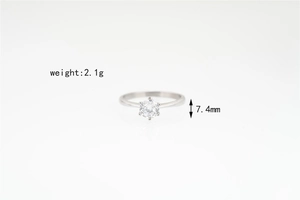 Detail view of 2.1g titanium steel ring featuring 7.4mm six-prong moissanite setting
