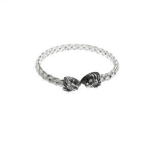 Vintage stainless steel woven bracelet featuring detailed Viking lion head finials