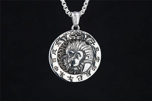 Macro detail of retro zodiac monkey pendant with Chinese characters on titanium steel