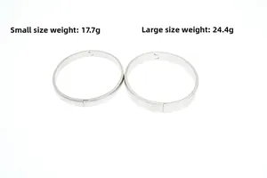 Detail view of two minimalist silver titanium steel bangles in small and large sizes