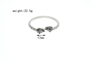 Detailed macro view of silver titanium steel woven wolf head bangle showing weight 22.5g