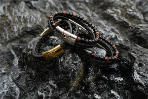 Detail of multi-layer leather bracelet with tiger eye beads and magnetic metal clasp