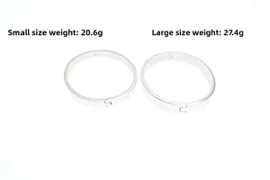 Detailed comparison of small and large oval titanium steel bangles with mirror finish
