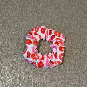 Elastic white scrunchie with pink and red lip print patterns for ponytail styling